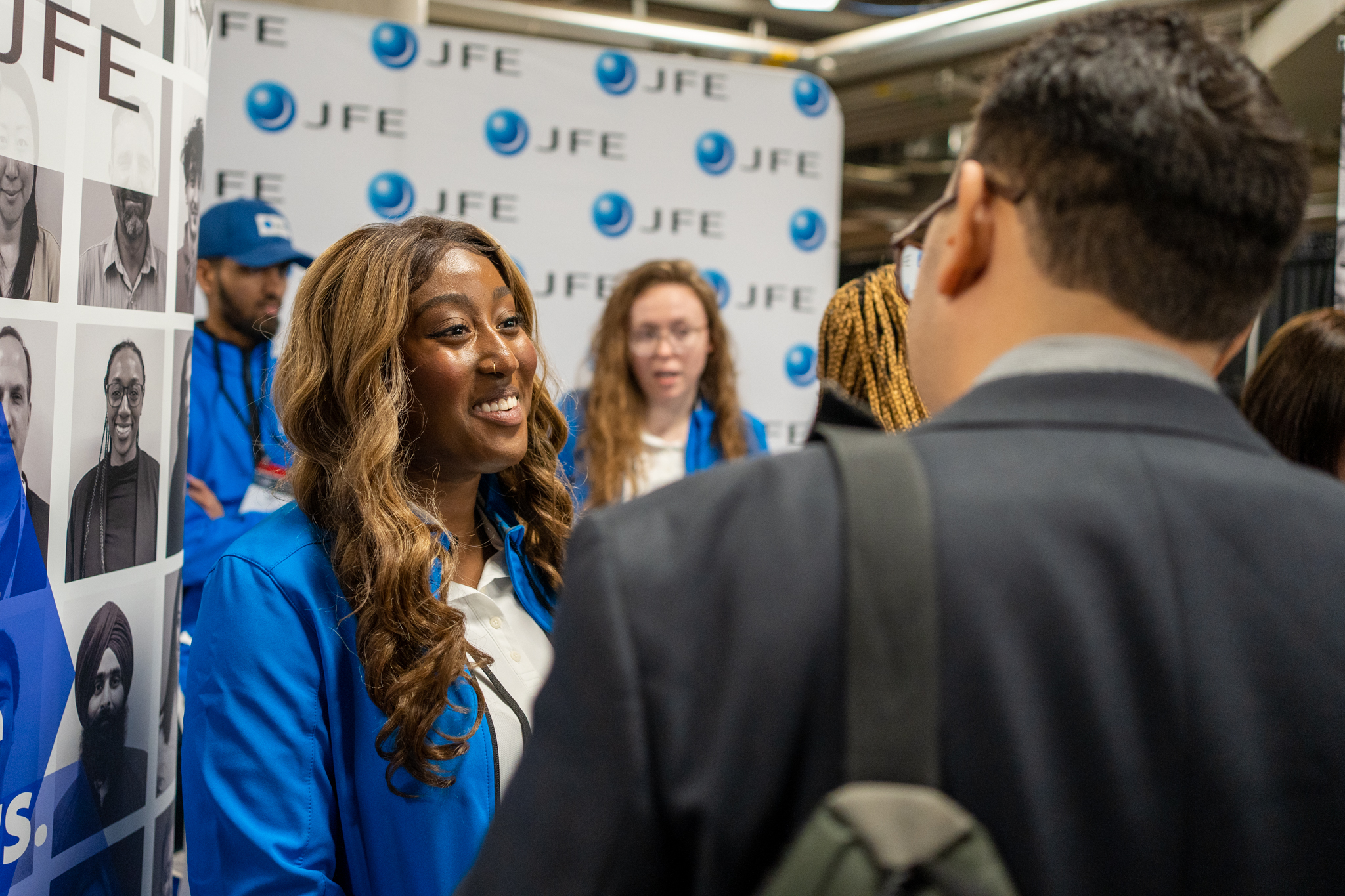 Student and employer connecting at a job fair.